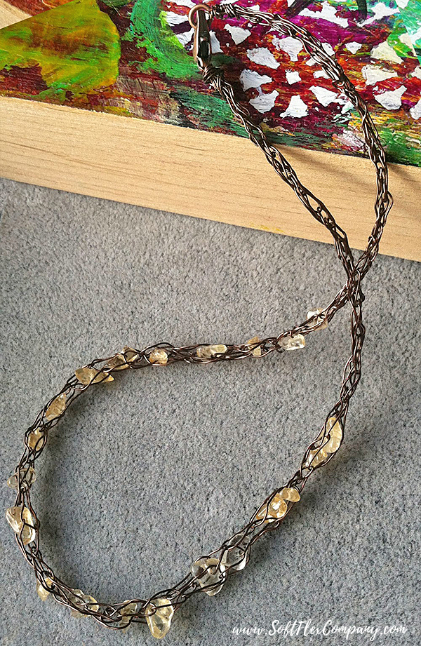 Knitted necklace with wire and beads
